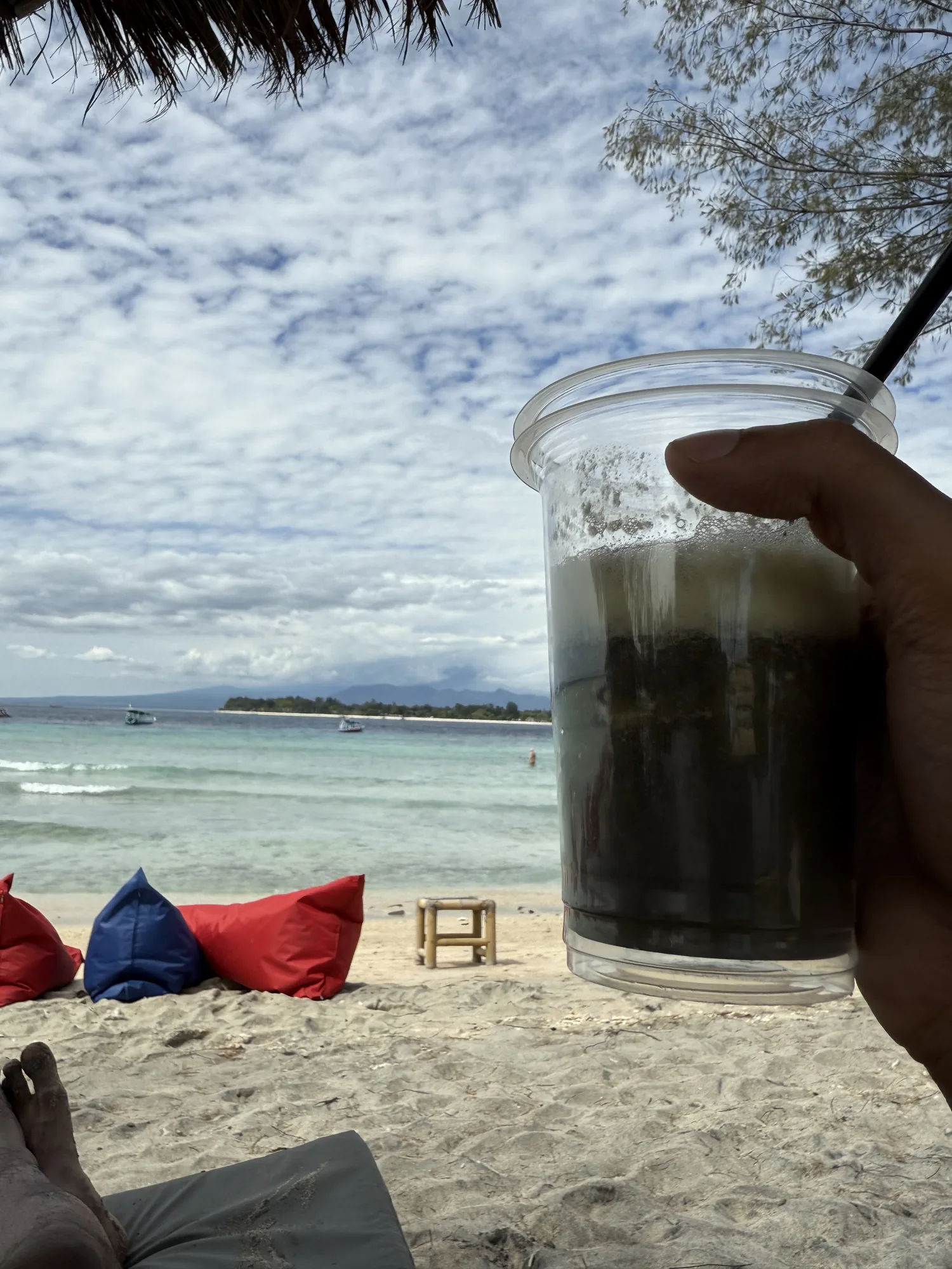 Bean bags on the beach at Gili Trawangan looking across to Lombok