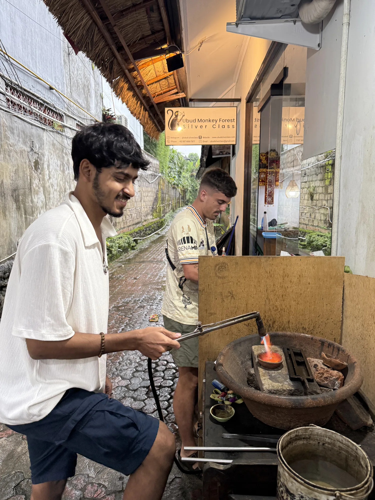 Melting silver over a torch at the silver class in Ubud